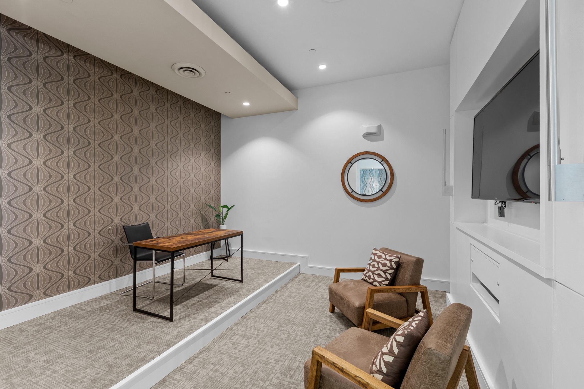 a living room with a couch and a table and a television